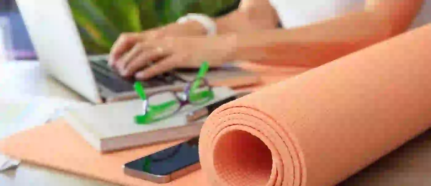 Welcome wellness into the workplace - Yoga-mat-wellbeing-hero-banner