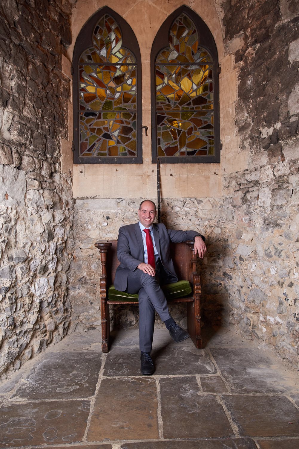 A person sitting on a chair in the local crypt at the Bleeding Heart.