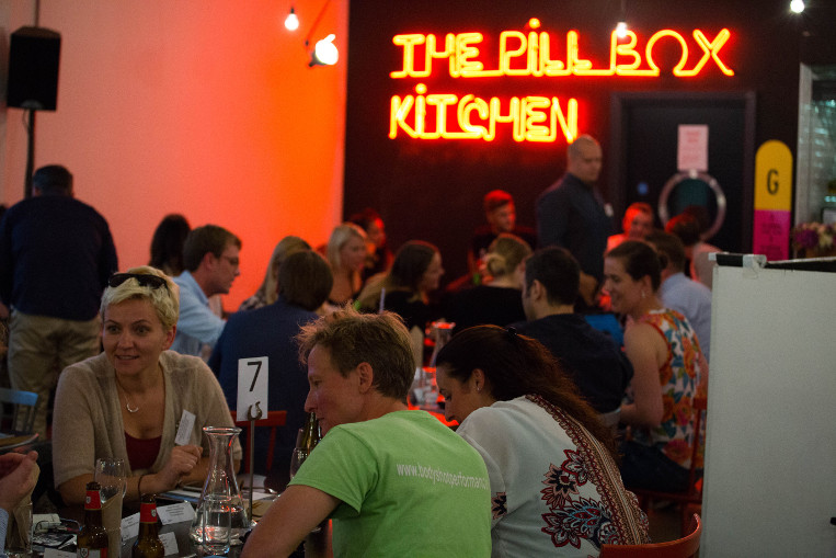 People talking at the wellness event at the Workspace® property, the Pill Box.