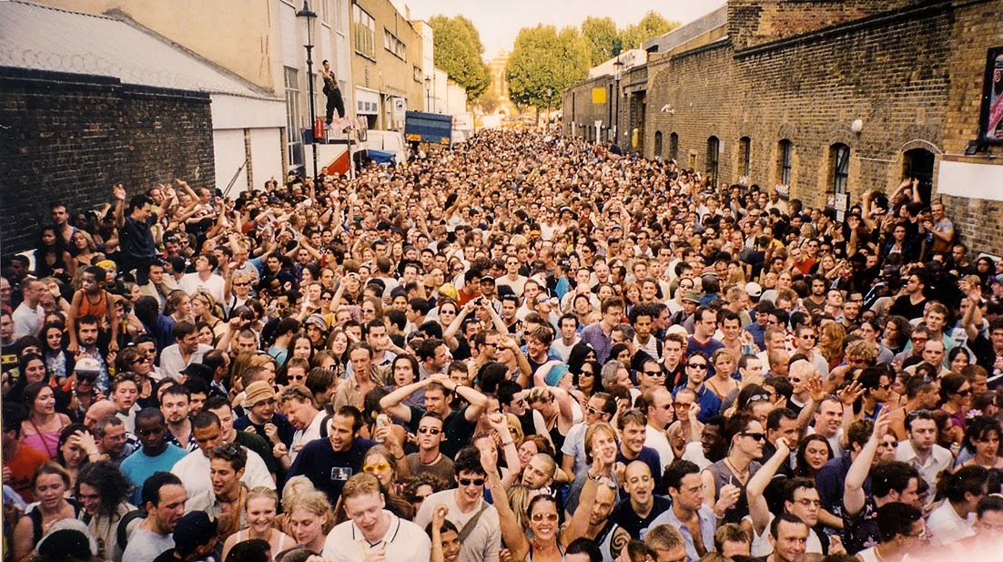 A crowd of people in a street for Notting Hill Carnival.