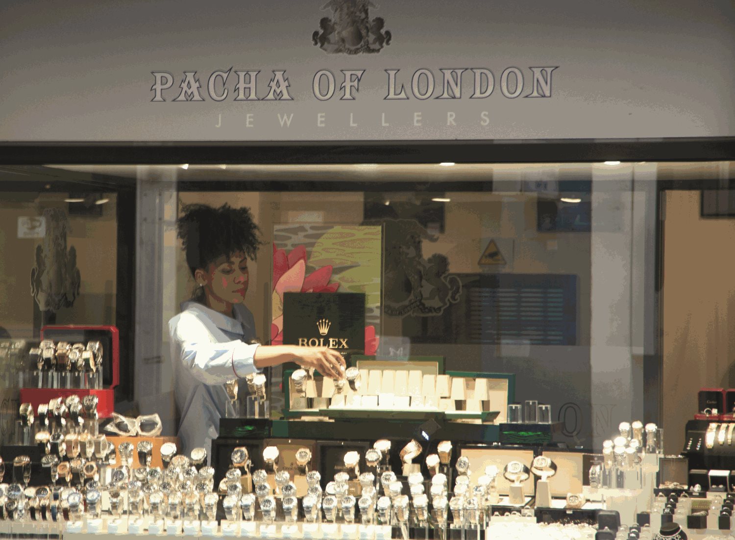 A shop window displaying a variety of luxury watches in Hatton Garden.