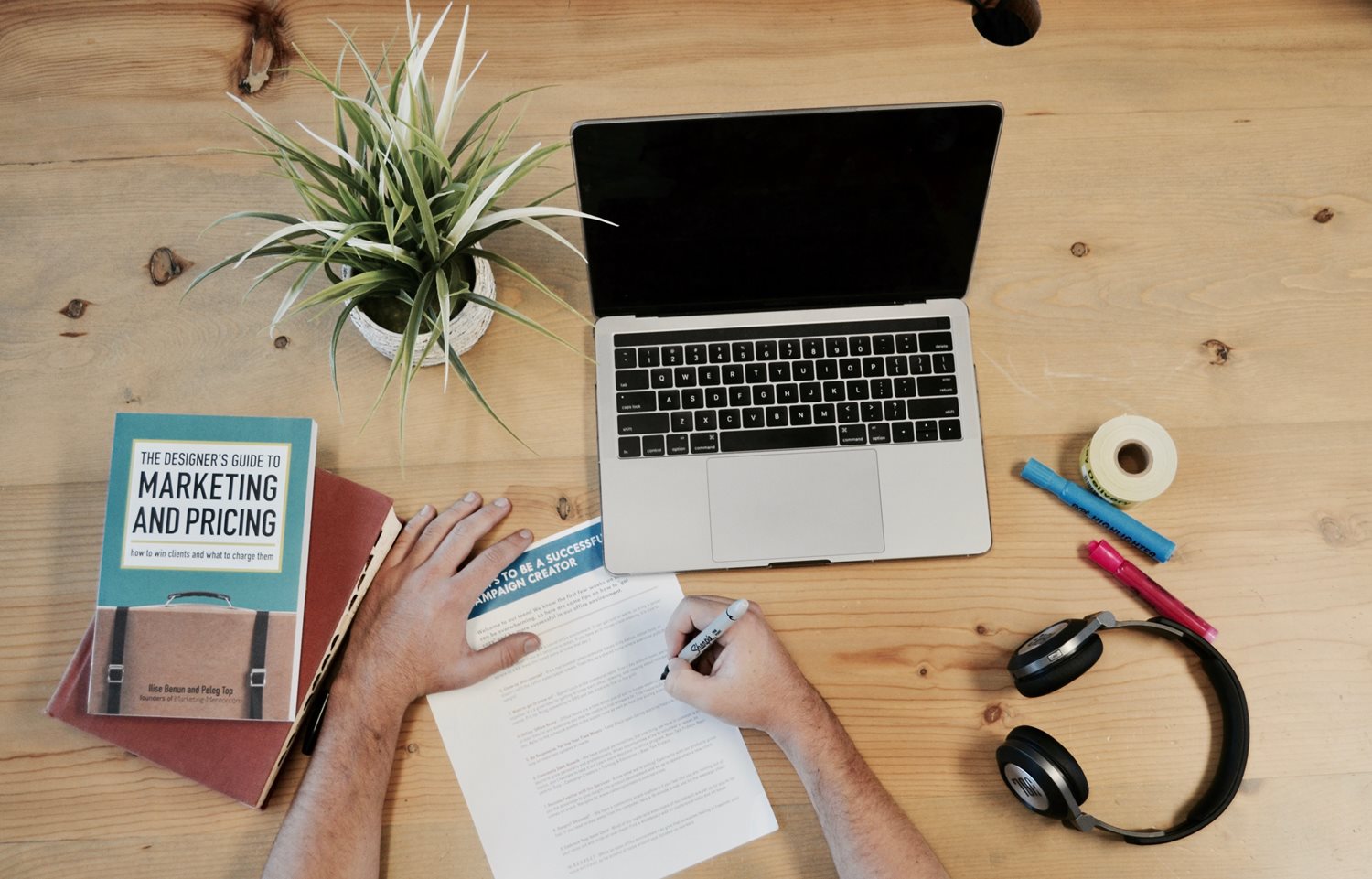 Birdseye view of a marketer’s desk.