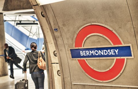 Woman walking through Bermondsey tube station.